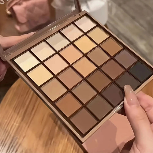 Paleta de Sombras com 25 Cores - Tons neutros de cinza e marrom terrosos, além de tons de café e chocolate, para criar uma maquiagem versátil, de natural a dramática.