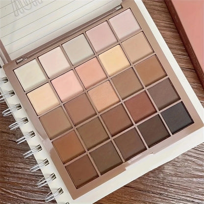 Paleta de Sombras com 25 Cores - Tons neutros de cinza e marrom terrosos, além de tons de café e chocolate, para criar uma maquiagem versátil, de natural a dramática.